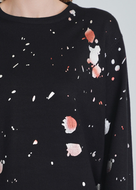 Unique Spotted Patterns on Black Knit Sweater