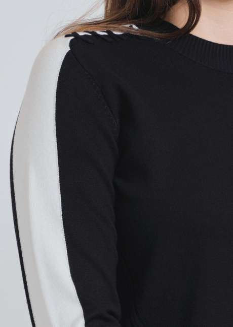 Distinctive Black Knit with Eye-Catching White Sleeve Bands