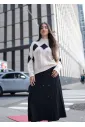 Black pleated midi skirt with button detail