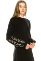 Black sweater with print on sleeves